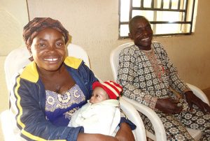 Chinyere Francis and her husband receive postpartum family planning services following the birth of their 10th child at a health center.