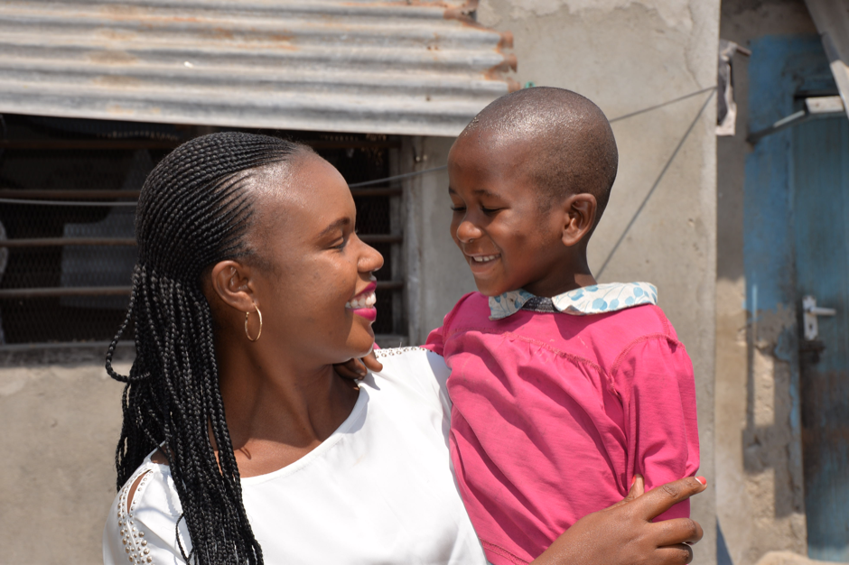 Woman holding child