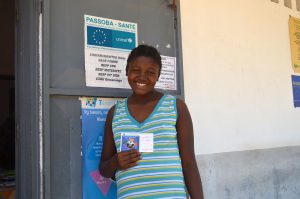 Woman smiling and holding card