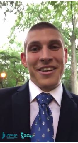 Head shot of man in suit and tie