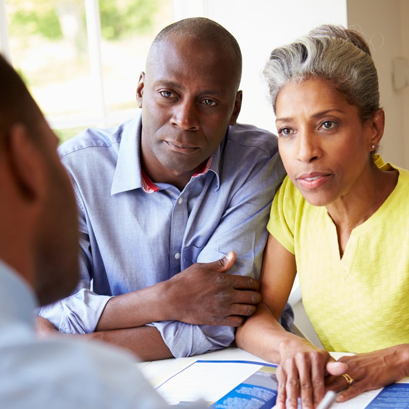 Mature Black Couple Meeting With Financial Advisor At Home