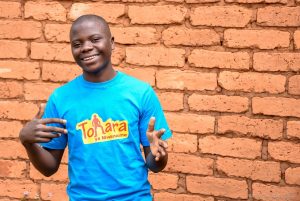 Smiling boy in blue shirt