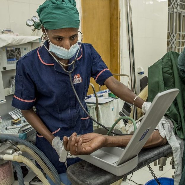 Nurse-anesthesiologist monitoring a patient.