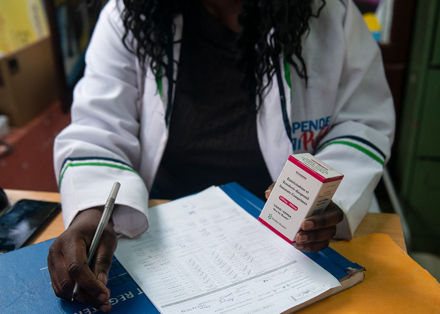 Clinician holding a box of antiretroviral medication