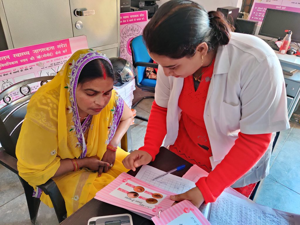 Nurse providing health care education in India.