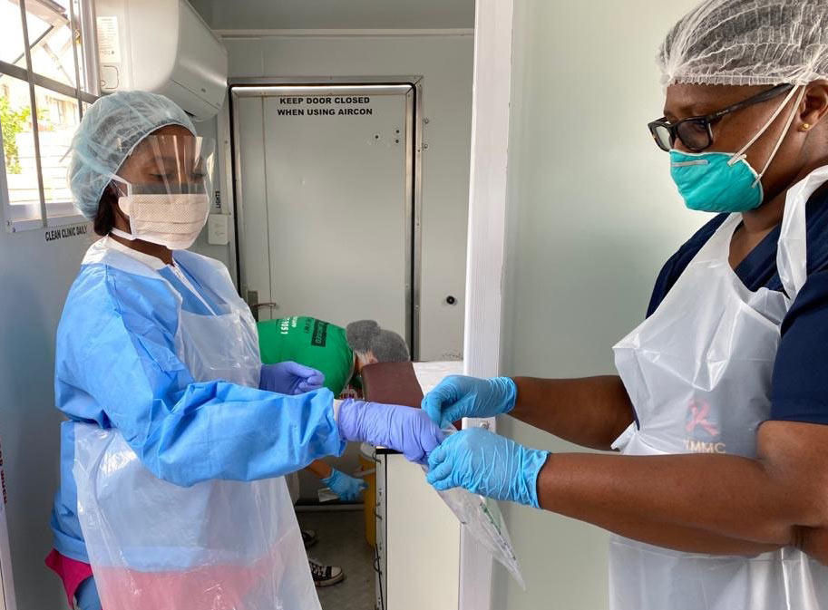 Nurses in protective gear.